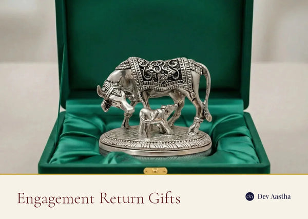 A silver-plated Kamdhenu idol in a gift box, an engagement return gift for roka and sagai guests