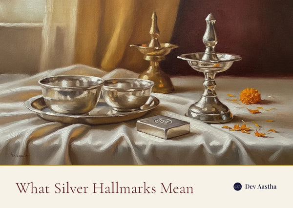 Silver puja items and a stamped silver ingot in warm light - what silver purity hallmarks mean