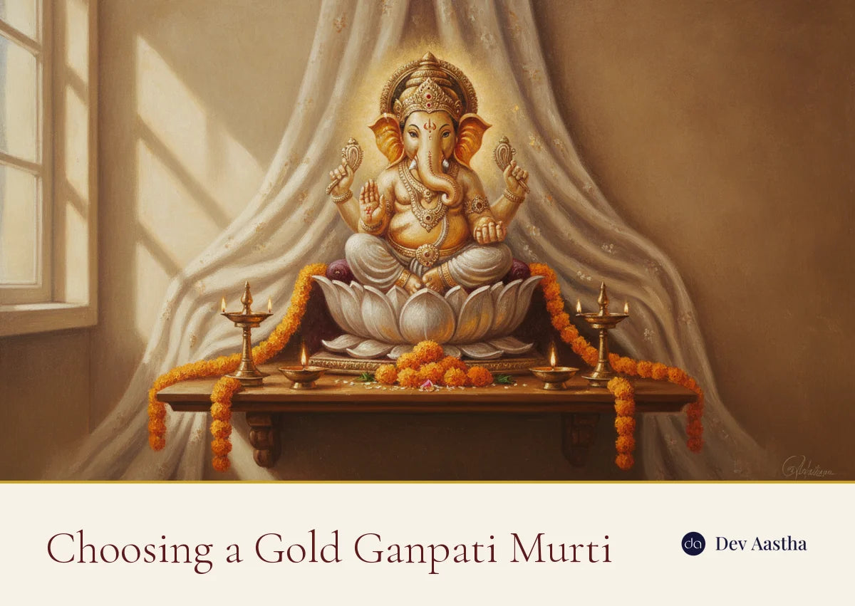 Gold and silver plated Lord Ganesha idol on a lotus throne with diyas and marigolds, a gold Ganpati murti for the home