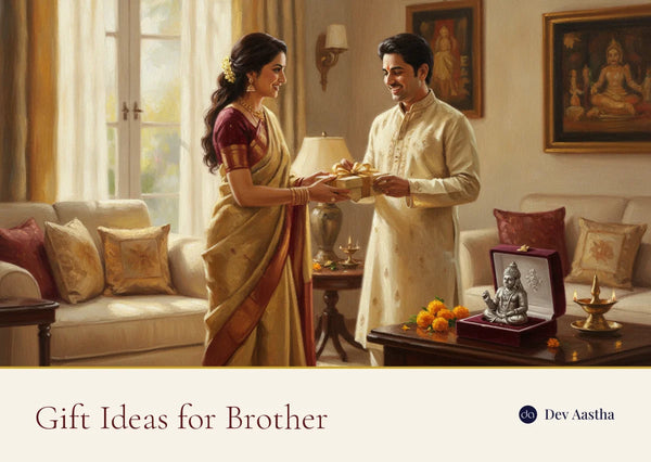 An Indian sister handing a wrapped gift box to her brother in a sunlit living room, a silver-plated Hanuman idol resting in an open velvet gift box beside them with marigolds and a lit diya