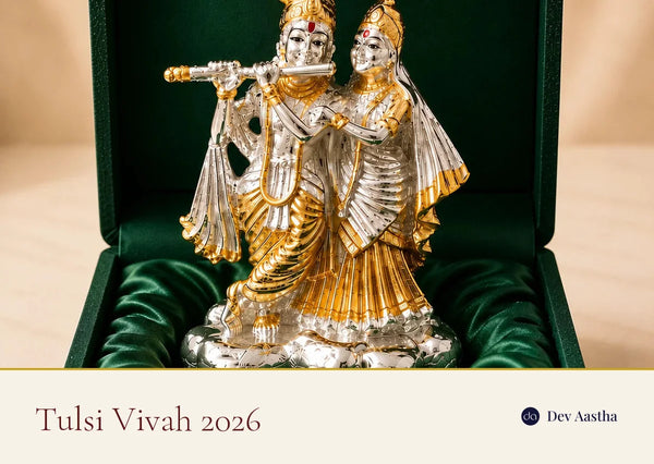 Silver-plated Radha Krishna idol beside a decorated Tulsi plant for Tulsi Vivah 2026