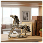 silver horse statue on wooden shelf with books, framed photo, and potted plant in living room