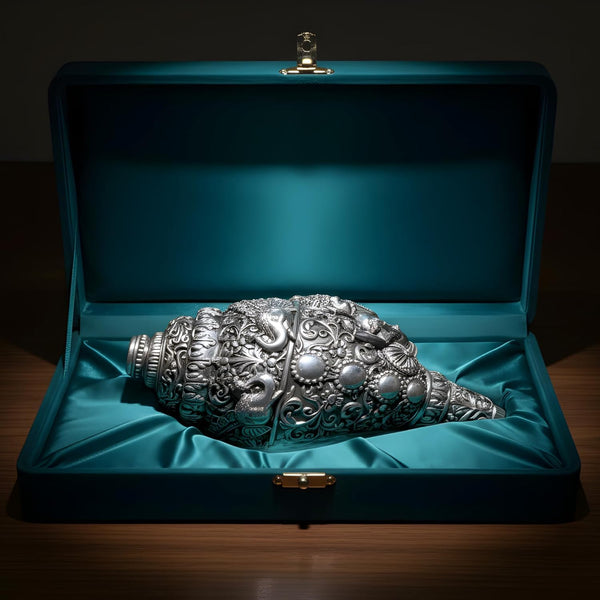 Ganesh shankh silver-plated resting on teal satin in a premium velvet gift box