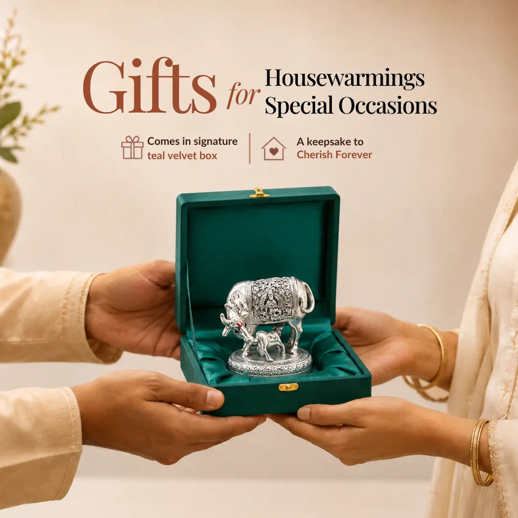 Hands presenting the 2.5 inch silver Kamdhenu cow idol in its signature teal velvet box as a housewarming gift #2-5-inch