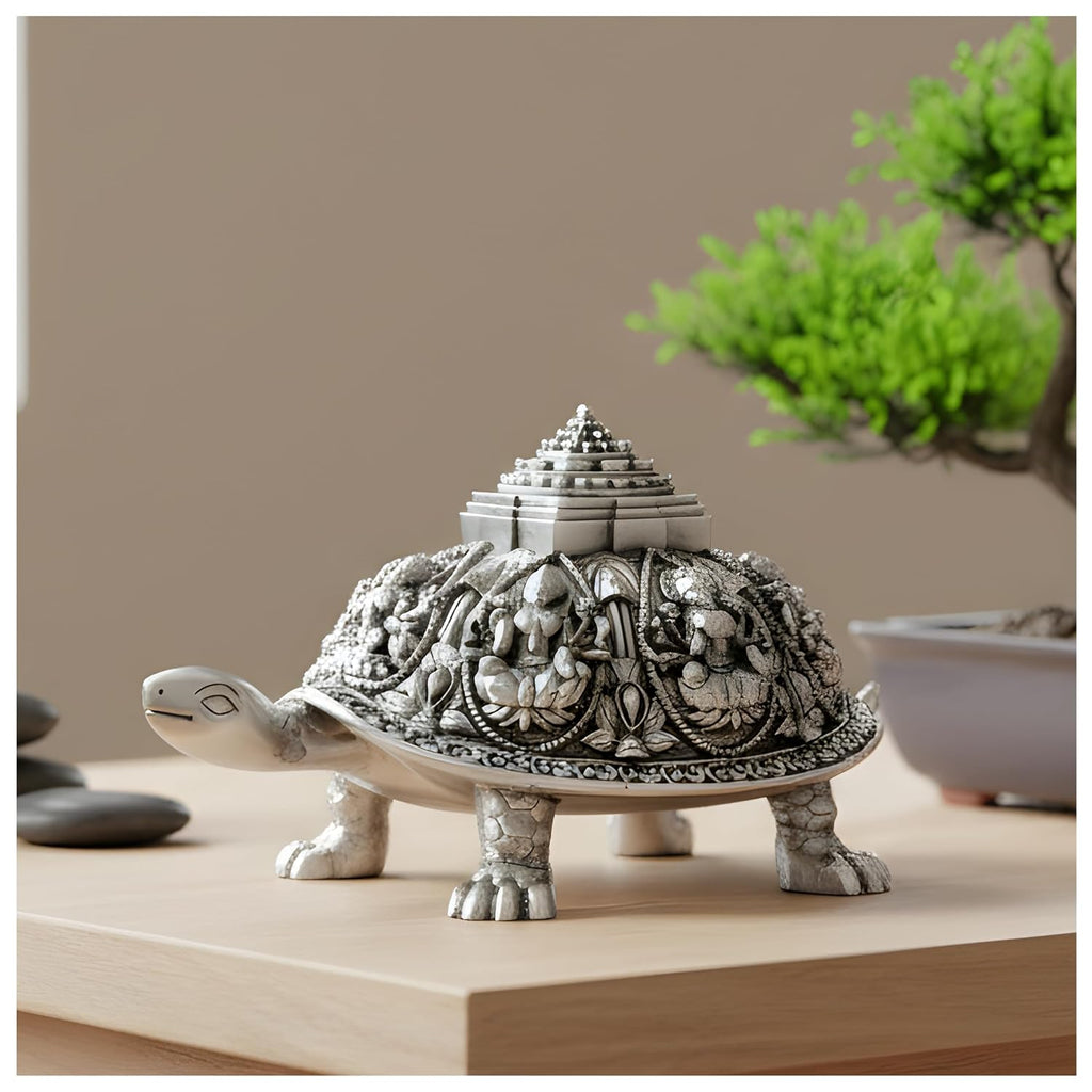 Ashta Lakshmi tortoise silver-plated idol, 4.5 inch size, on a light wood console beside a bonsai