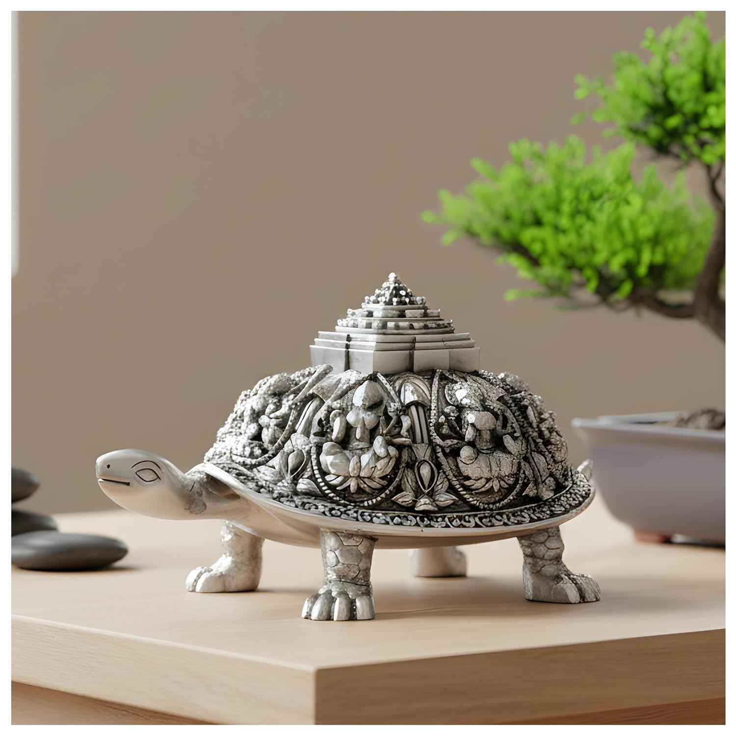 Ashta Lakshmi tortoise silver-plated idol, 4.5 inch size, on a light wood console beside a bonsai