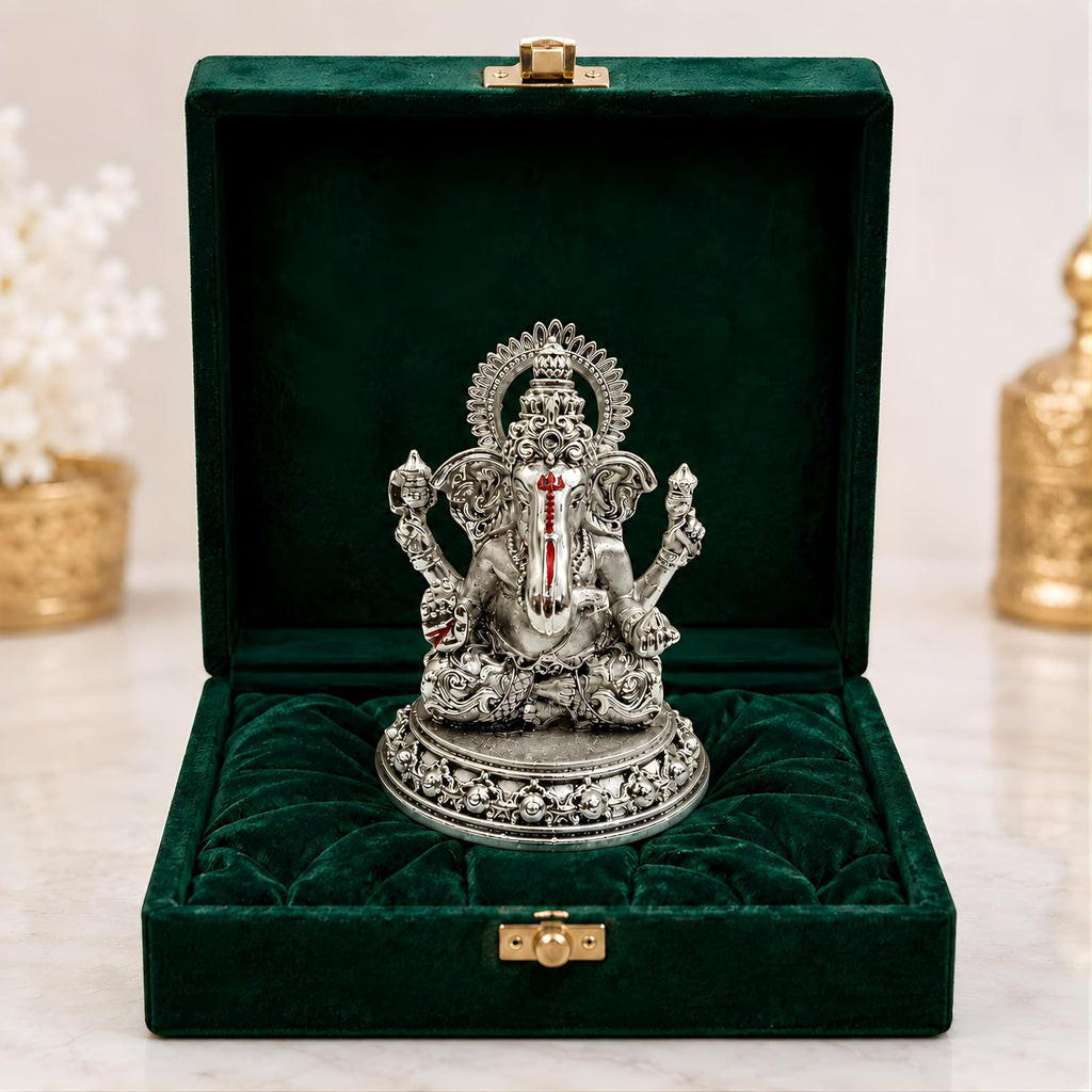 Lakshmi Ganesh silver-plated set styled on an office desk
