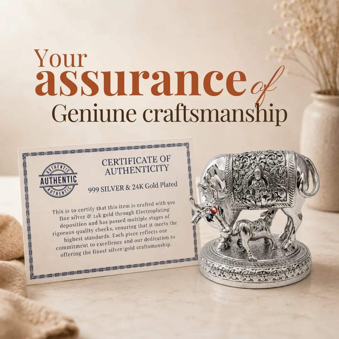 Certificate of authenticity for genuine craftsmanship placed beside the 2.5 inch silver-plated Kamdhenu cow and calf idol #2-5-inch
