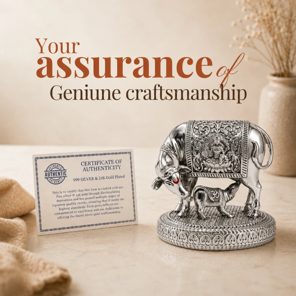 Certificate of authenticity for genuine craftsmanship placed beside the 3.5 inch silver Kamdhenu cow and calf idol #3-5-inch