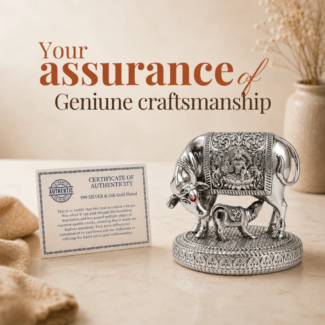 Certificate of authenticity for genuine craftsmanship placed beside the 3.5 inch silver Kamdhenu cow and calf idol #3-5-inch