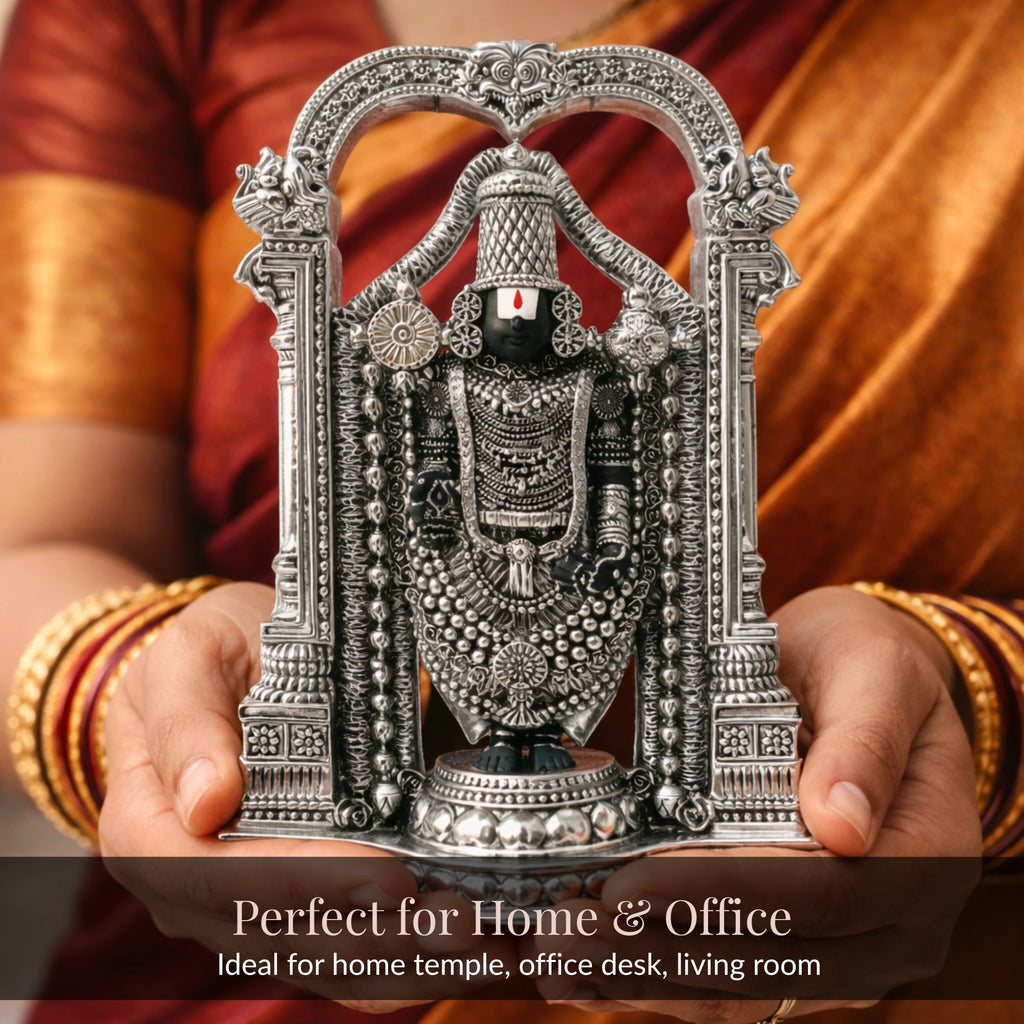 Hands in saree and bangles holding standing Balaji silver-plated idol for home and office
