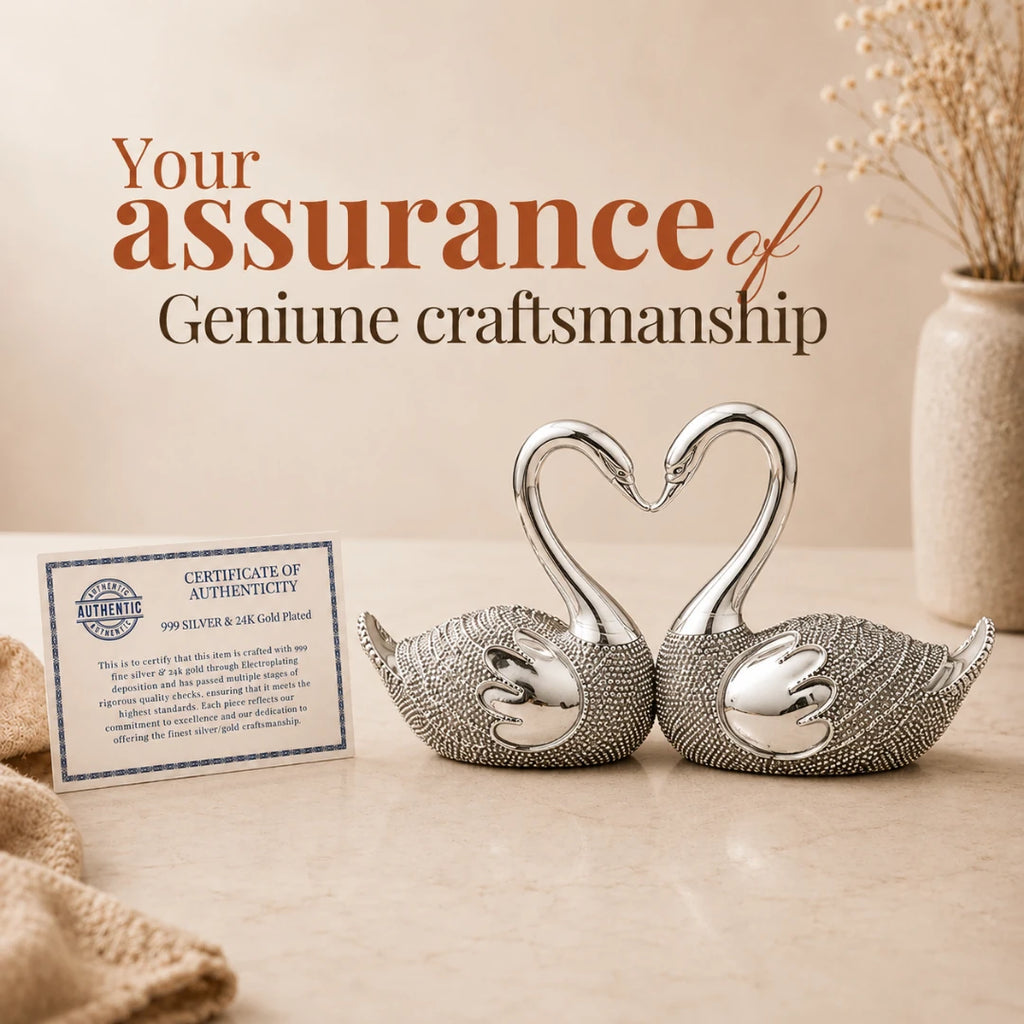 Certificate of authenticity for genuine craftsmanship placed beside the silver-plated swan pair #5-inch